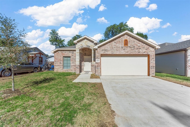 view of front of house with a garage, a front yard, brick siding, and driveway