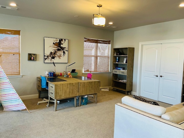 office area featuring carpet, visible vents, and baseboards