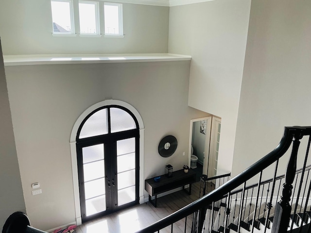 entrance foyer with french doors and stairway