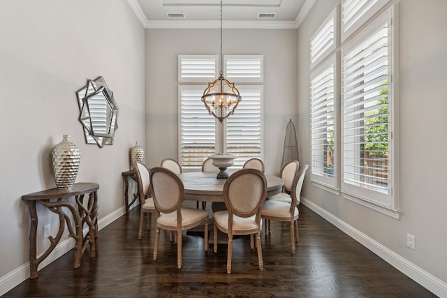 dining room featuring dark wood-style floors, baseboards, a chandelier, and ornamental molding