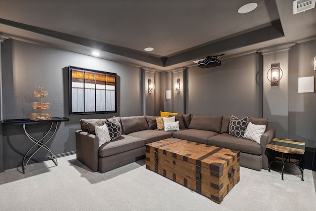 living room with carpet, a raised ceiling, and visible vents