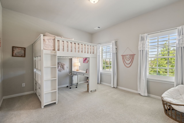 bedroom with carpet, visible vents, and baseboards