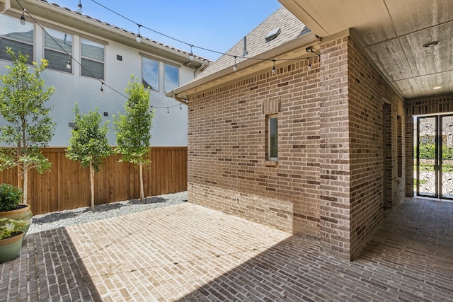 view of patio featuring fence