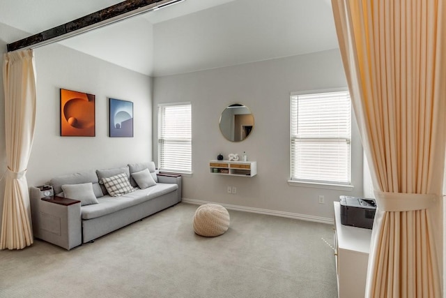 living room with light carpet, lofted ceiling with beams, and baseboards