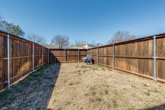 view of yard with a fenced backyard