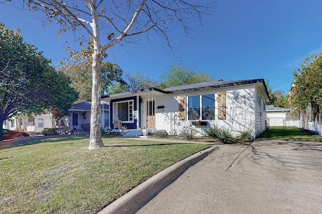 view of front of property with a front lawn, a porch, and fence