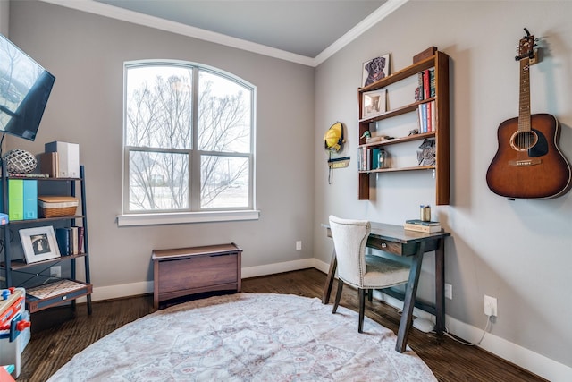 office space featuring baseboards, wood finished floors, and crown molding