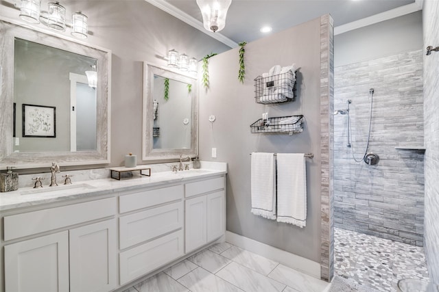 full bath featuring marble finish floor, walk in shower, a sink, and double vanity