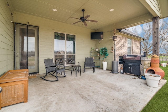 view of patio with a grill and ceiling fan