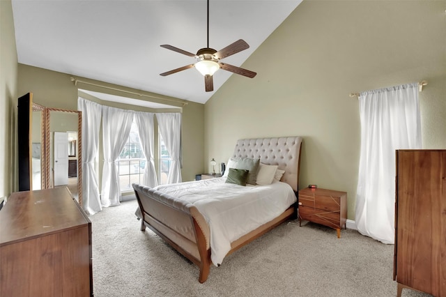 carpeted bedroom featuring access to exterior, ceiling fan, and high vaulted ceiling