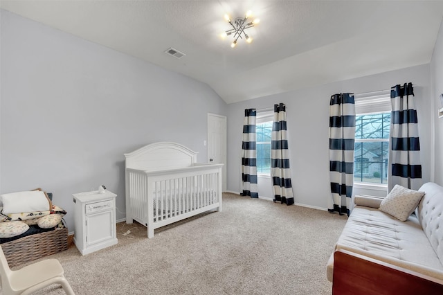 bedroom featuring vaulted ceiling, multiple windows, carpet, and baseboards