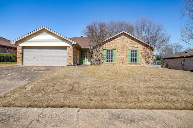 ranch-style house featuring a front yard, brick siding, driveway, and an attached garage