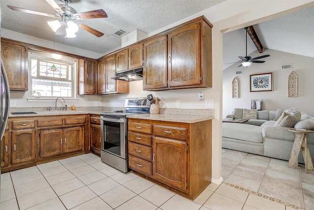 kitchen featuring visible vents, stainless steel electric range oven, light countertops, under cabinet range hood, and a sink