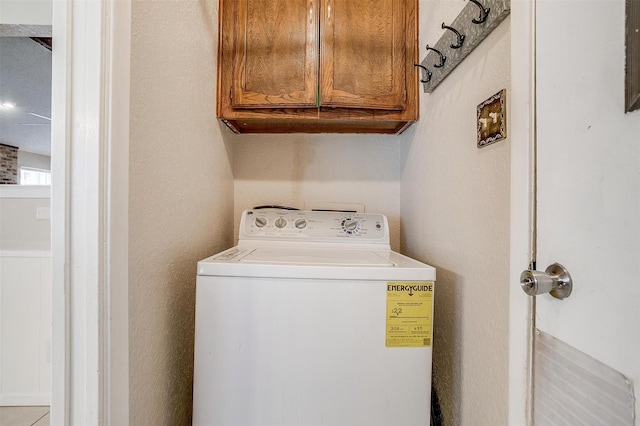 laundry room with washer / clothes dryer and cabinet space