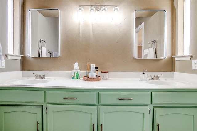 bathroom with a sink and double vanity