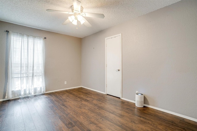 empty room featuring ceiling fan, a textured ceiling, and wood finished floors