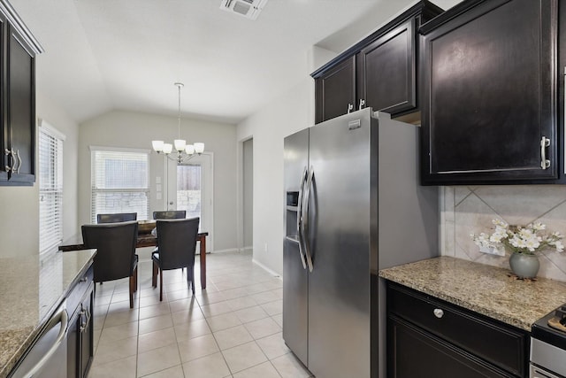 kitchen featuring light tile patterned floors, tasteful backsplash, visible vents, appliances with stainless steel finishes, and a chandelier