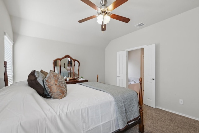 carpeted bedroom featuring baseboards, visible vents, a ceiling fan, lofted ceiling, and ensuite bathroom