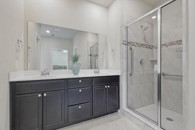 full bath featuring a stall shower and a sink