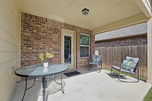 view of patio featuring fence