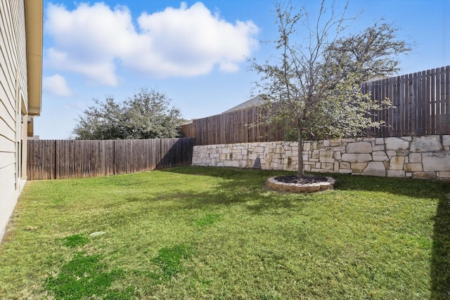 view of yard with a fenced backyard