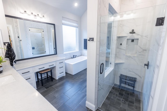 bathroom featuring wood tiled floor, vanity, a shower stall, and a freestanding bath