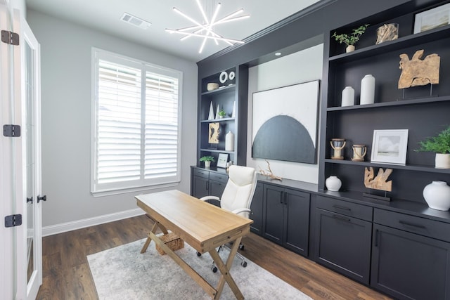 home office with visible vents, baseboards, dark wood finished floors, a chandelier, and built in features