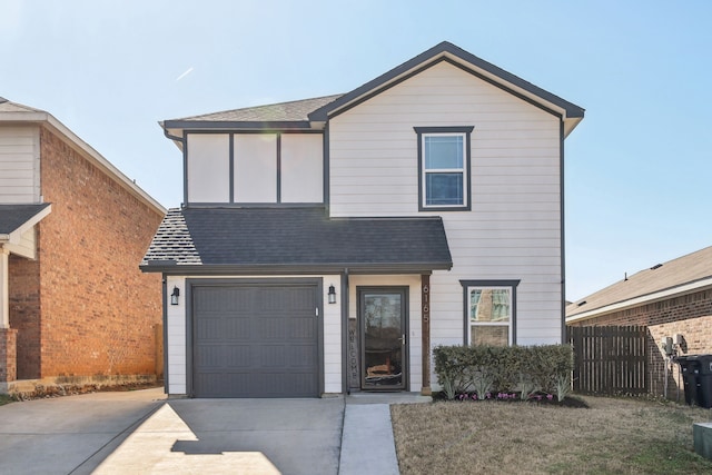 view of front of property featuring a garage, concrete driveway, a shingled roof, and fence