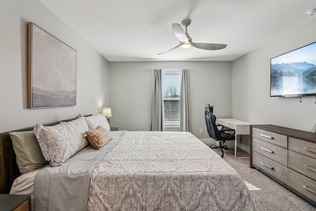 bedroom featuring a ceiling fan and light colored carpet