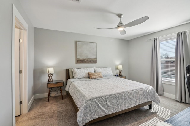 bedroom with carpet flooring, ceiling fan, and baseboards