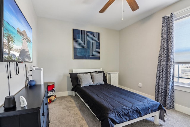 bedroom featuring ceiling fan, carpet flooring, and baseboards