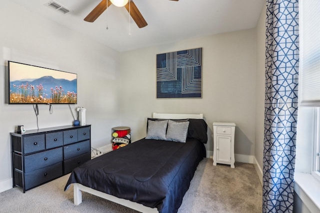 bedroom with ceiling fan, carpet, visible vents, and baseboards