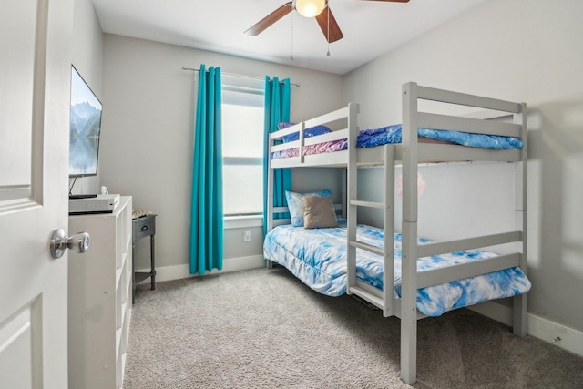 bedroom featuring carpet floors, a ceiling fan, and baseboards