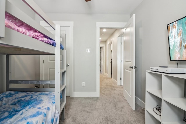 bedroom with carpet and baseboards