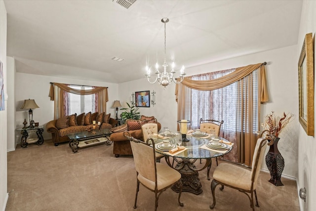 carpeted dining space with a chandelier and visible vents