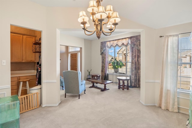 living area with light colored carpet, baseboards, and an inviting chandelier