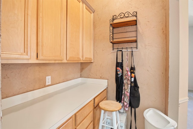 bathroom featuring a textured wall