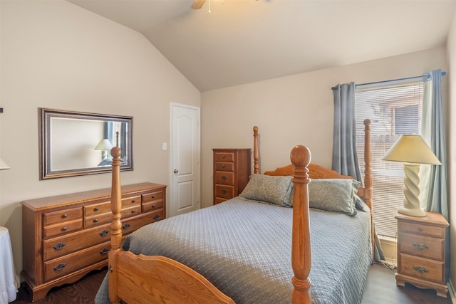 bedroom with lofted ceiling, ceiling fan, and dark wood-type flooring