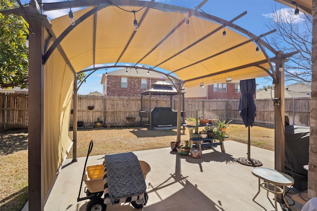 view of patio / terrace with a fenced backyard and a pergola