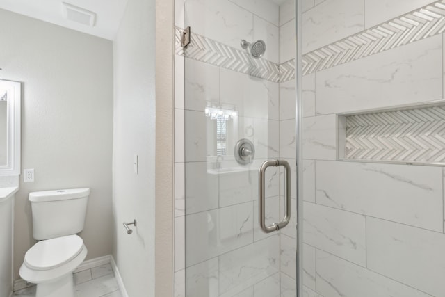 bathroom featuring marble finish floor, visible vents, toilet, a shower stall, and baseboards