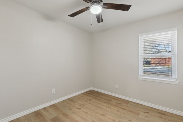 unfurnished room with light wood-style floors, ceiling fan, and baseboards