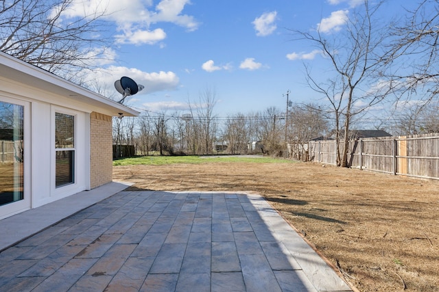 view of patio / terrace featuring fence