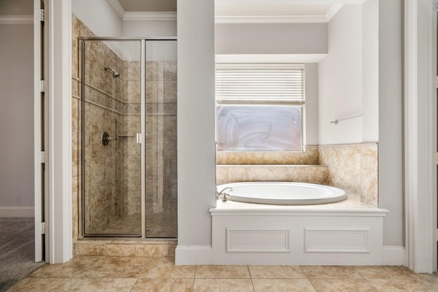 full bathroom featuring tile patterned flooring, a garden tub, crown molding, and a shower stall