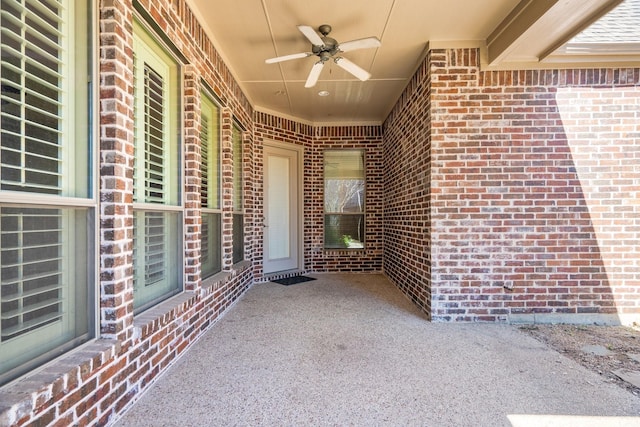 view of patio featuring ceiling fan