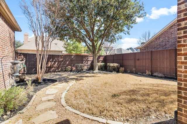 view of yard featuring a fenced backyard