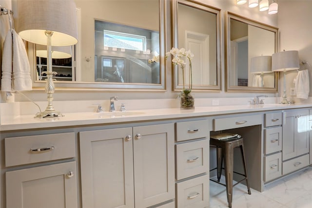 full bath featuring a shower, marble finish floor, a sink, and double vanity