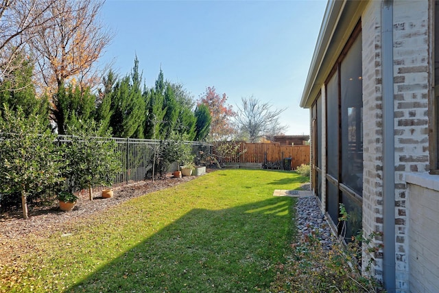 view of yard with a fenced backyard