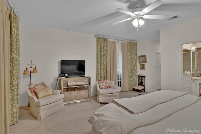 bedroom with crown molding, visible vents, carpet flooring, ceiling fan, and ensuite bath