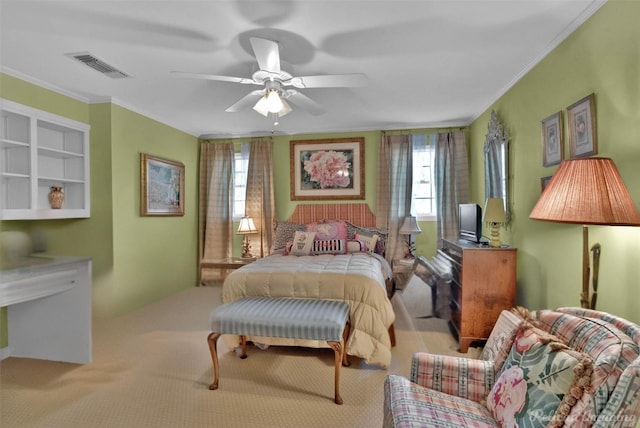 bedroom featuring ceiling fan, ornamental molding, and visible vents