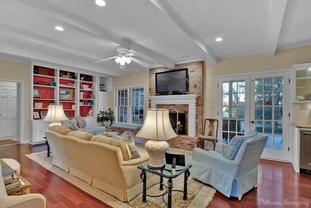 living area with recessed lighting, beam ceiling, a fireplace, and wood finished floors